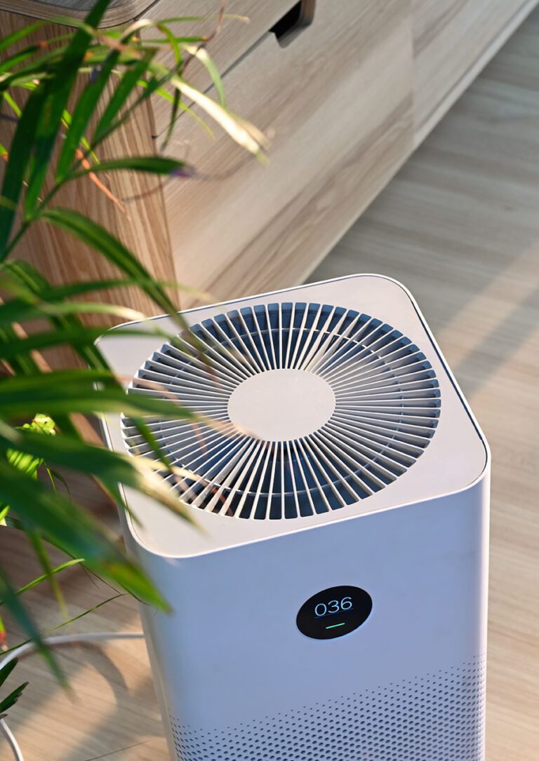 Indoor Air Quality purifier on wooden floor in comfortable home Fresh air and healthy life