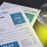 Electricity bill and light bulb, household cost increase concept.
