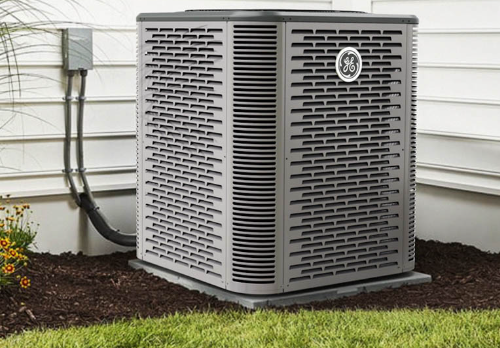 General Electric heat pump on the ground