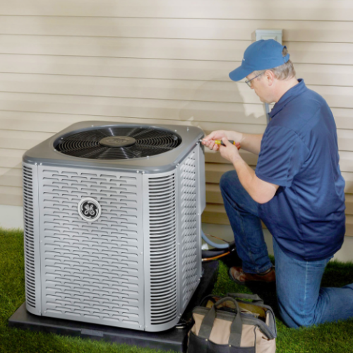 Technician installing AC unit